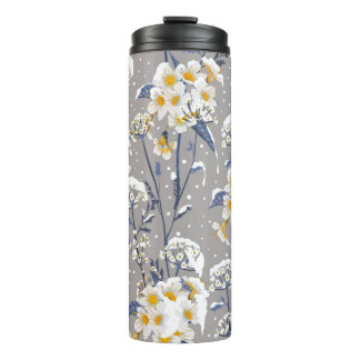 Beautiful winter flower blooming in the snow delic thermal tumbler