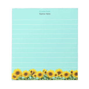 Beaux tournesols sur le bloc-notes bleu ciel