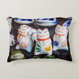Beckoning cat figurines accent pillow