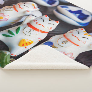 Beckoning cat figurines sherpa blanket