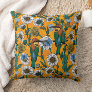 Bee-eaters, blue butterflies and daisies on orange throw pillow
