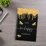 Bee happy black bumble bees glitter monogram 2025 planner<br><div class="desc">Decorated with happy,  smiling yellow and black  bumble bees. A chic black background and faux gold glitter drips,  paint dripping look. White hand lettered script with swashes and the text: Bee Happy.  Personalize and add your name and a year. Perfect for school,  work or organizing your personal/family life.</div>