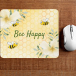 Bee Happy bumble bees yellow honeycomb summer Mouse Pad<br><div class="desc">Yellow,  white background with a honeycomb pattern. Decorated with light yellow,  cream coloured tropical florals flowers,  hibiscus and happy bumble bees. The text: Bee Happy in green hand lettered style script. Perfect for your summer home work space,  office!</div>