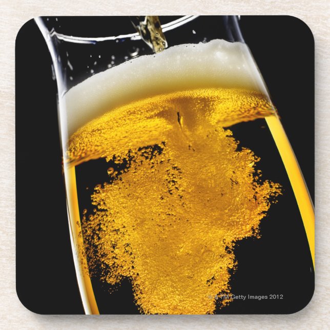Beer been poured into glass, studio shot coaster (Front)