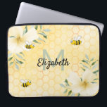 Bees honeycomb florals yellow monogram laptop sleeve<br><div class="desc">Add some fun and humor to your home office! Yellow, white background with a bee honeycomb pattern and happy smiling bumble bees. Decorated with light yellow, cream colored tropical Hibiscus florals , flowers. Template for your name and monogram letter, green and black letters. The name is written with a hand...</div>