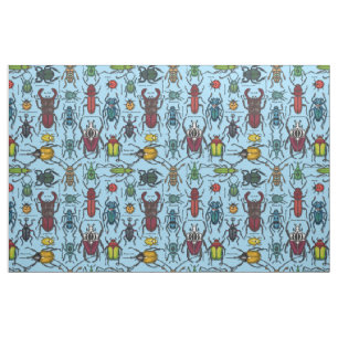 Beetles on blue fabric
