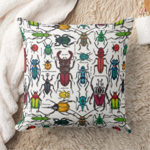 Beetles on white throw pillow