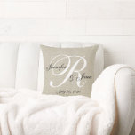 Beige Linen Monogram Newlywed Wedding Keepsake Throw Pillow<br><div class="desc">Personalized beige, black and white monogrammed pillow with bride and groom names and wedding date in a script font overlay design on a PRINTED beige linen photo effect background. Elke Clarke© for MonogramGallery at Zazzle. Makes a great gift for newly weds. Great trendy, elegant accessory for your bedroom, favorite chair,...</div>