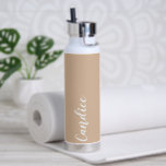 Beige Personalized Wedding Bridesmaid Water Bottle<br><div class="desc">Gift your wedding bridesmaid or maid of honour with this trendy, vacuum Insulated water bottle that features her name in white, stylized script on a beige colour background designed to match your wedding colour scheme. Personalize bottle by editing and replacing name with your own as desired. Select your water bottle...</div>