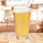 Beige Stylized Wedding Groomsman Name Glass<br><div class="desc">Beer glass for the wedding groomsman that features his name printed in a trendy beige colour, stylized script inside a beige colour oval border along with wedding date. A great party supply idea for a bachelor party! Personalize your beer glass by editing and replacing name and date with your own....</div>