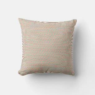 Beige throw pillow with a small, red geometric