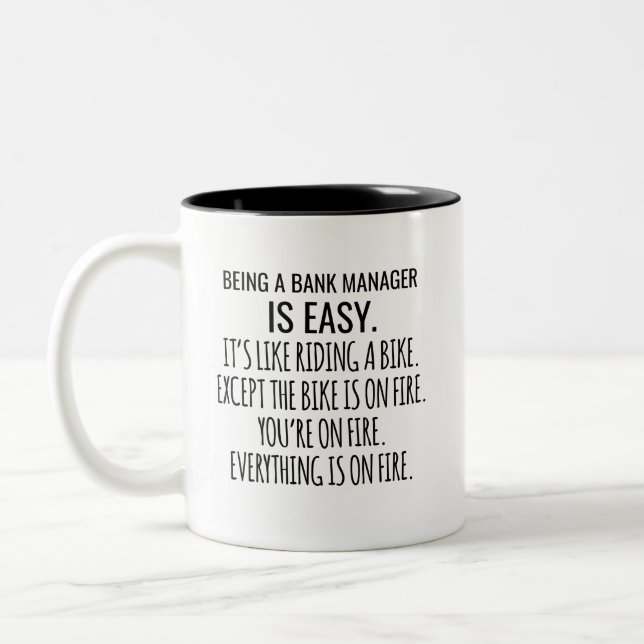 Being A Bank Manager Is Easy It's Like Riding A Two-Tone Coffee Mug (Left)