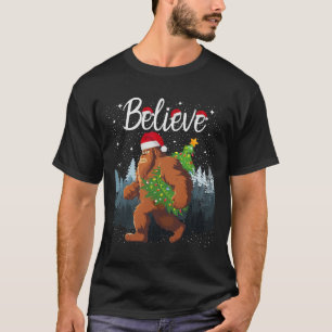 Believe Bigfoot Carrying Christmas Tree Wearing A T-Shirt