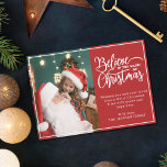 Believe in Christmas magic 2 family photos red Holiday Card<br><div class="desc">Modern holiday greeting card featuring one of your favourite Christmas family portraits on the left complemented by the words "Believe in the magic of Christmas" on the right over a festive red background, customizable with your own greeting message. You can upload one more picture on the reverse of the card....</div>