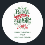 Believe in the Magic Christmas Typography Classic Round Sticker<br><div class="desc">Stickers with a cute illustration. Text says Believe in the Magic in fancy lettering. Decorated with christmas balls.</div>