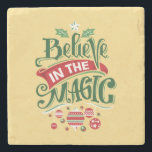 Believe in the Magic Christmas Typography Stone Coaster<br><div class="desc">A stone coaster with a cool illustration. Text says Believe in the Magic in fancy lettering. Decorated with christmas balls.</div>