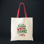 Believe in the Magic Christmas Typography Tote Bag<br><div class="desc">A tote bag with a cute illustration. Text says Believe in the Magic in fancy lettering. Decorated with christmas balls.</div>