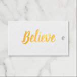 Believe typography minimalist Foil Gift Tag<br><div class="desc">Believe in typography and minimalist design in gold foil. The back text is Christmas,  and the year is in gold colour. A place for to and from names. These can be personalized. Simple and sophisticated.</div>