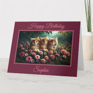 Belle chatons à gingembre avec carte de fleurs ros