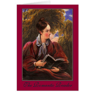 Belle femme de lecteur romantique avec le livre