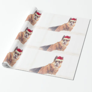 Berger allemand dans le papier de cadeau de neige
