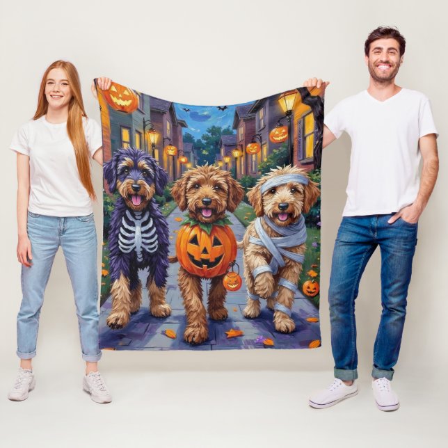 Bernedoodle Dogs Trick-or-Treating in Halloween Co Fleece Blanket (In Situ)