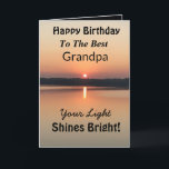 Best Grandpa Light Shines Bright Birthday Card<br><div class="desc">Express your wishes to your grandpa for a happy day on an inspirational sunset birthday card with the verse “Your Light Shines Bright”. The minimal design is modern with bold colours of gold and black showing glowing water and a peaceful lake.</div>