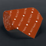 Best Man Repeating White Text on Rust Orange Tie<br><div class="desc">This fun neck tie is the perfect accessory for the best man at your wedding. It features a simple yet elegant design with the words "Best Man" written in fancy all capital white text repeating in a diagonal pattern on a rust orange or burnt umber coloured background. There are diamonds...</div>