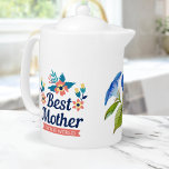 Best Mother in the World | Mother's Day<br><div class="desc">Sip your favourite tea with a touch of elegance and sentimentality with this stunning "Best mother in the world" teapot adorned with a beautiful blue watercolor flower design. The vibrant blue flowers and green leaves pop against the white porcelain background, making it a stylish and eye-catching addition to your kitchenware....</div>