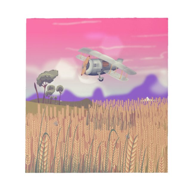 Bi-Plane Flying over crops under setting sun Notepad (Front)