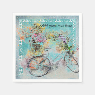 Bicycle with flower baskets on blue burlap napkin