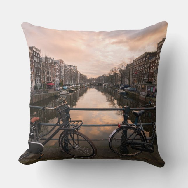 Bicycles at sunset in Amsterdam Throw Pillow (Front)
