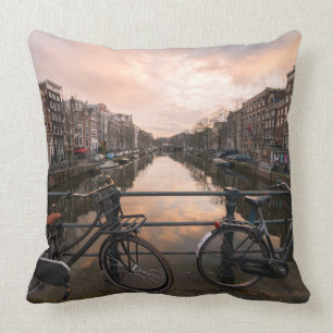 Bicycles at sunset in Amsterdam Throw Pillow