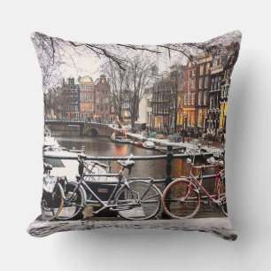 Bicycles in the snow in Amsterdam Throw Pillow