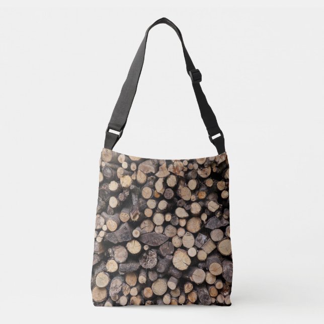 Big pile of cut logs stacked on top of each other crossbody bag (Front)