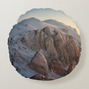 BIG ROCK FORMATIONS COVERED WITH SNOW ROUND PILLOW
