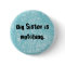 Big Sister is watching. Round blue button
