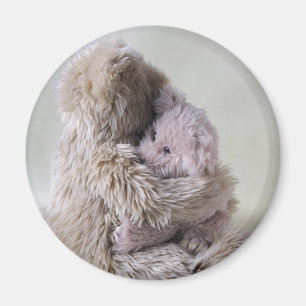 big teddy bear holds little bear magnet