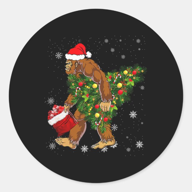 bigfoot carrying christmas tree sasquatch believer classic round sticker (Front)