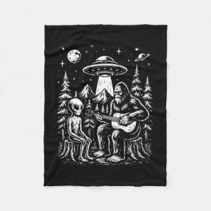Bigfoot playing guitar with alien and ufo fleece blanket