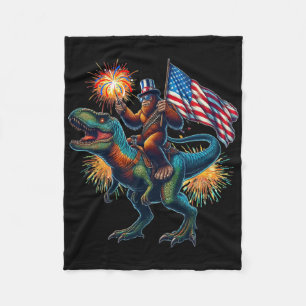Bigfoot Sasquatch Riding Dinosaur T Rex. Funny 4th Fleece Blanket