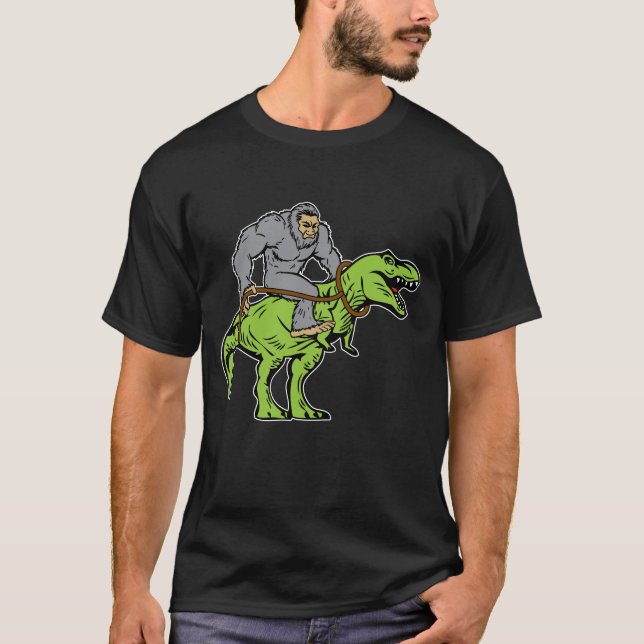 Bigfoot Sasquatch Riding Dinosaur T rex T-Shirt (Front)