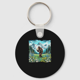 Bigfoot walks in flower field forest sasquatch keychain