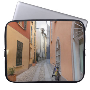 BIKE PARKED BESIDE WALL ON ALLEY LAPTOP SLEEVE