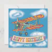 Biplane flying over happy birthday banner