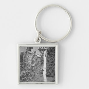 Bird house in garden keychain