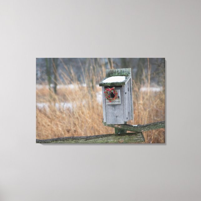 Bird, nest box with holiday wreath in winter canvas print (Front)