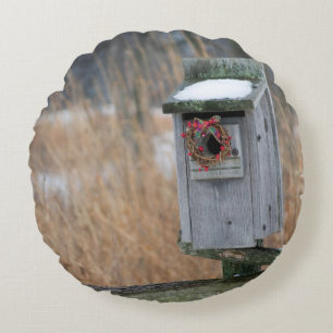 Bird, nest box with holiday wreath in winter round pillow