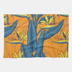 Bird of paradise flowers on orange kitchen towel