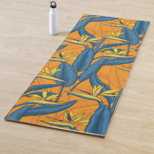 Bird of paradise flowers on orange yoga mat